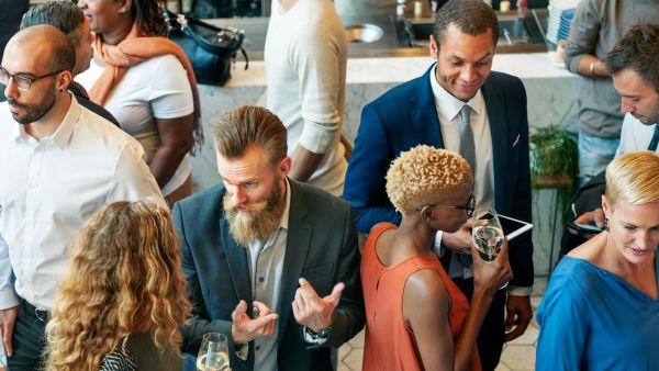 People talking at a business networking event.