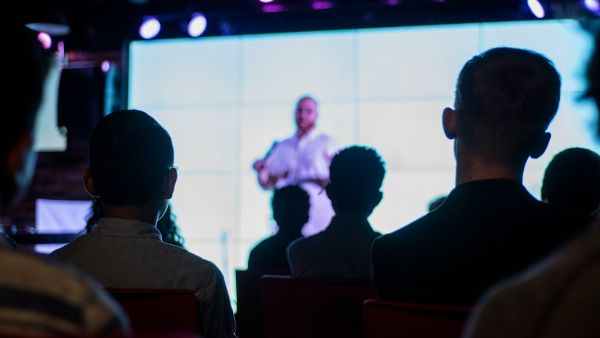 A presentation screen at an NSW Small Business Month event.