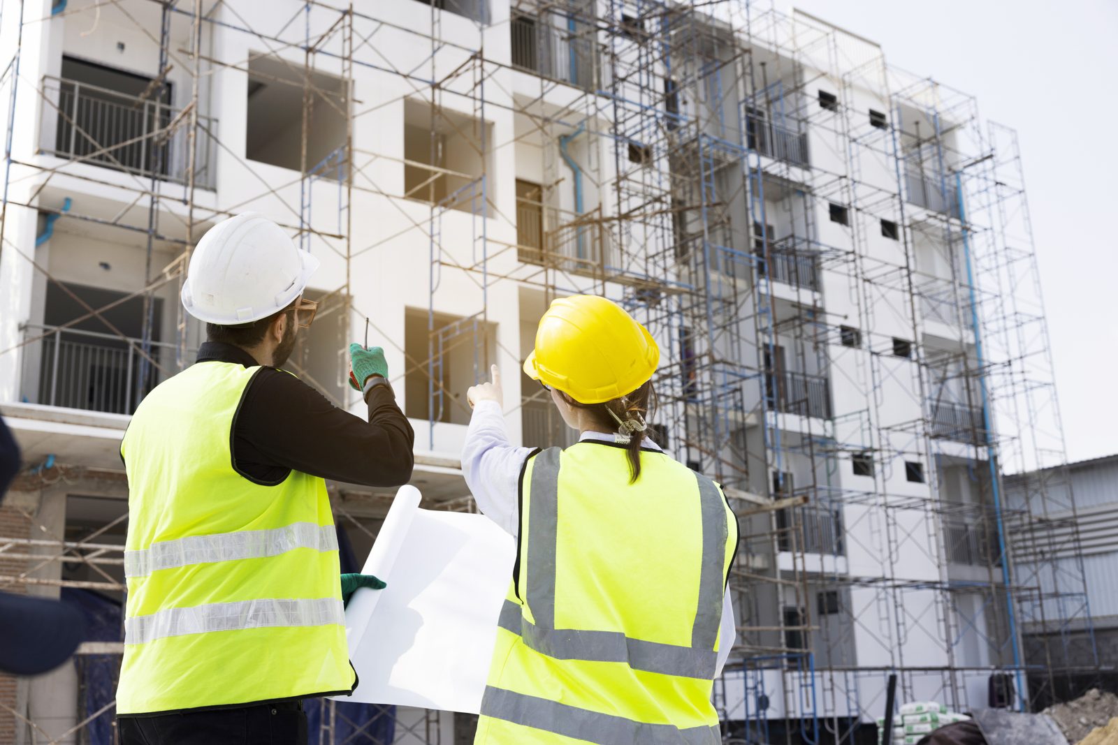 Building inspectors at an apartment building under construction, illustrating the Building Commission NSW regulation update.
